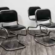 Ensemble de 4 chaises à bascule en acier chromé design années 80 vintage moderne.