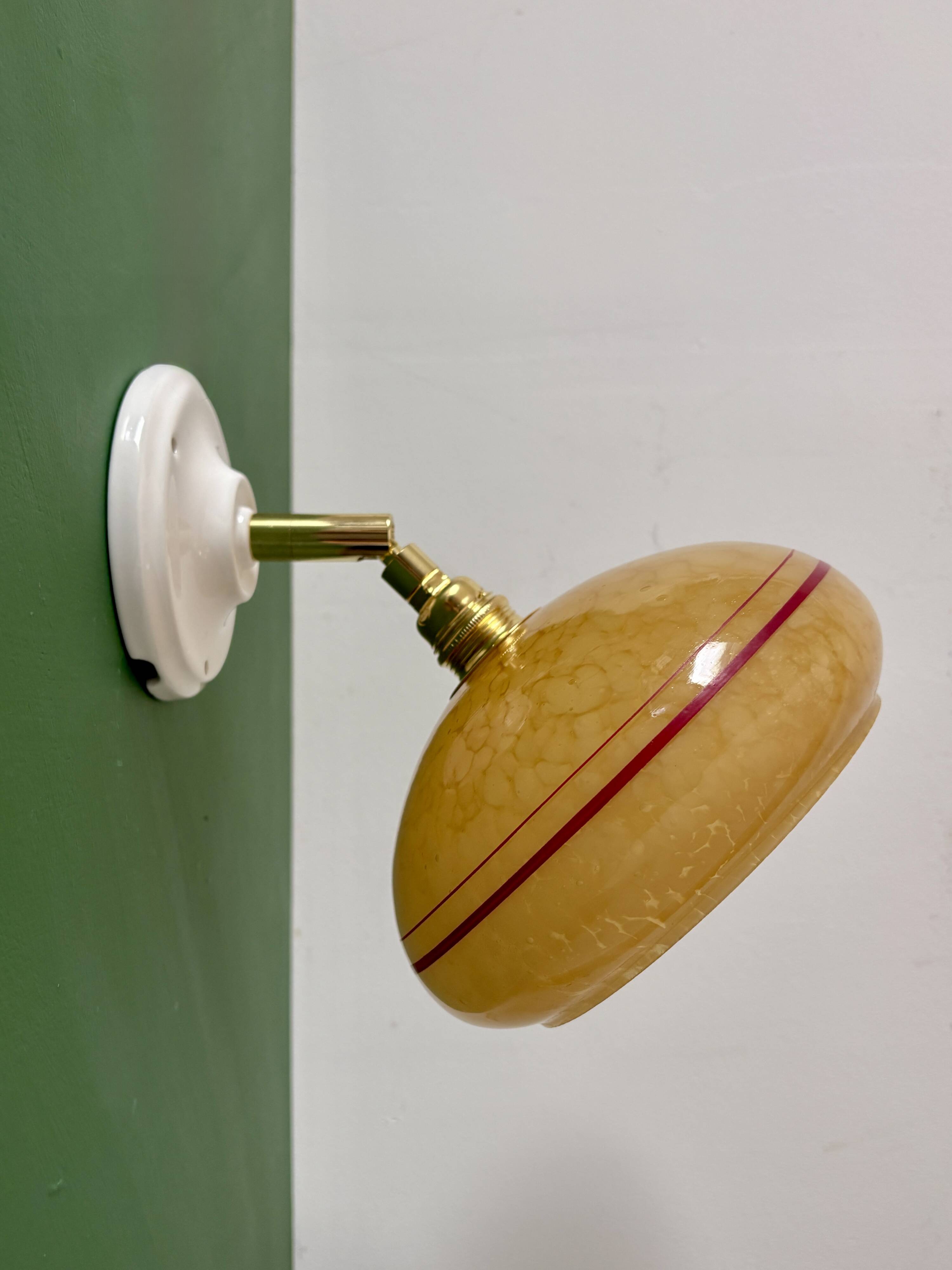 Vintage wall lamp with yellow clichy glass shade and red trim