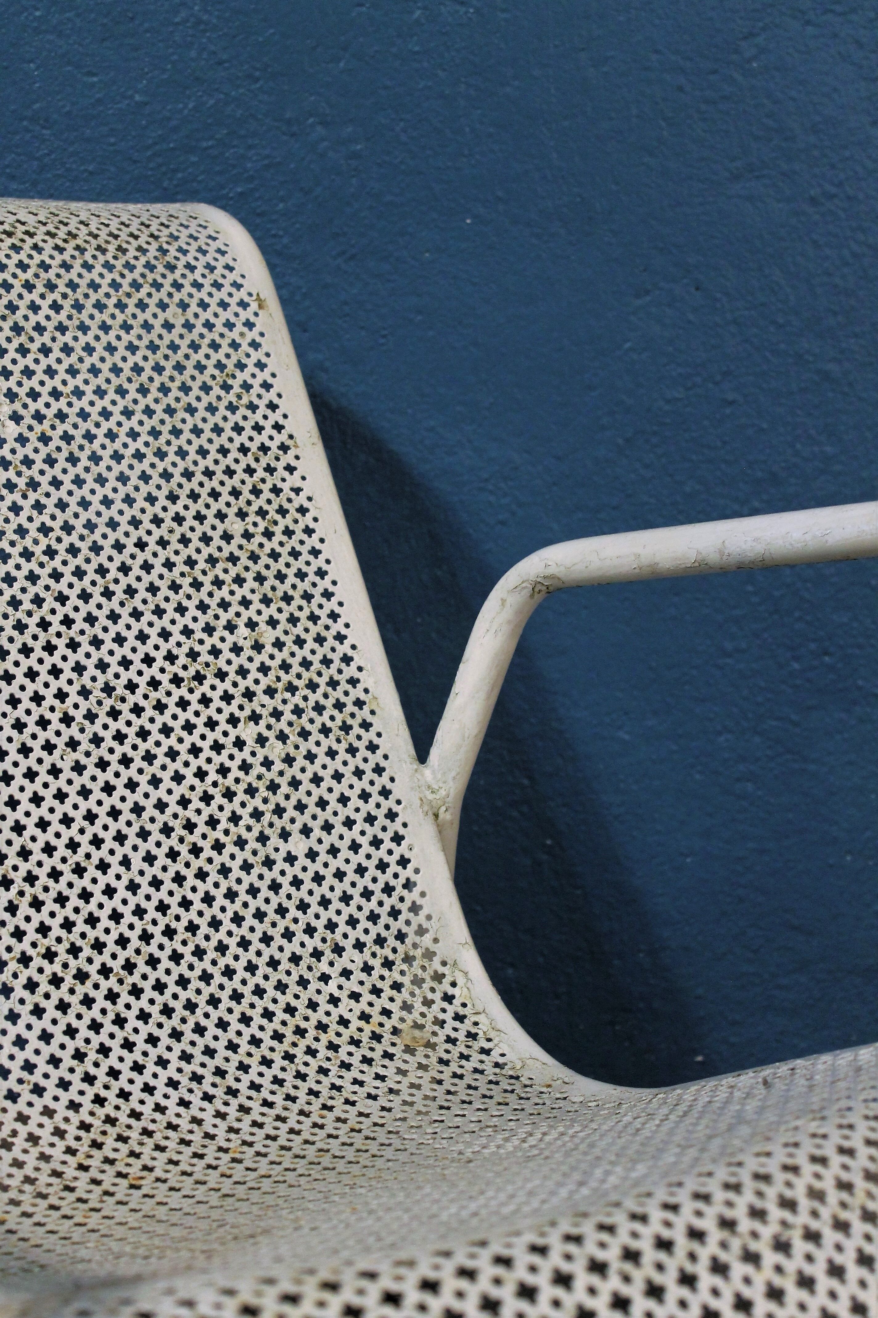 1960 perforated metal garden armchairs