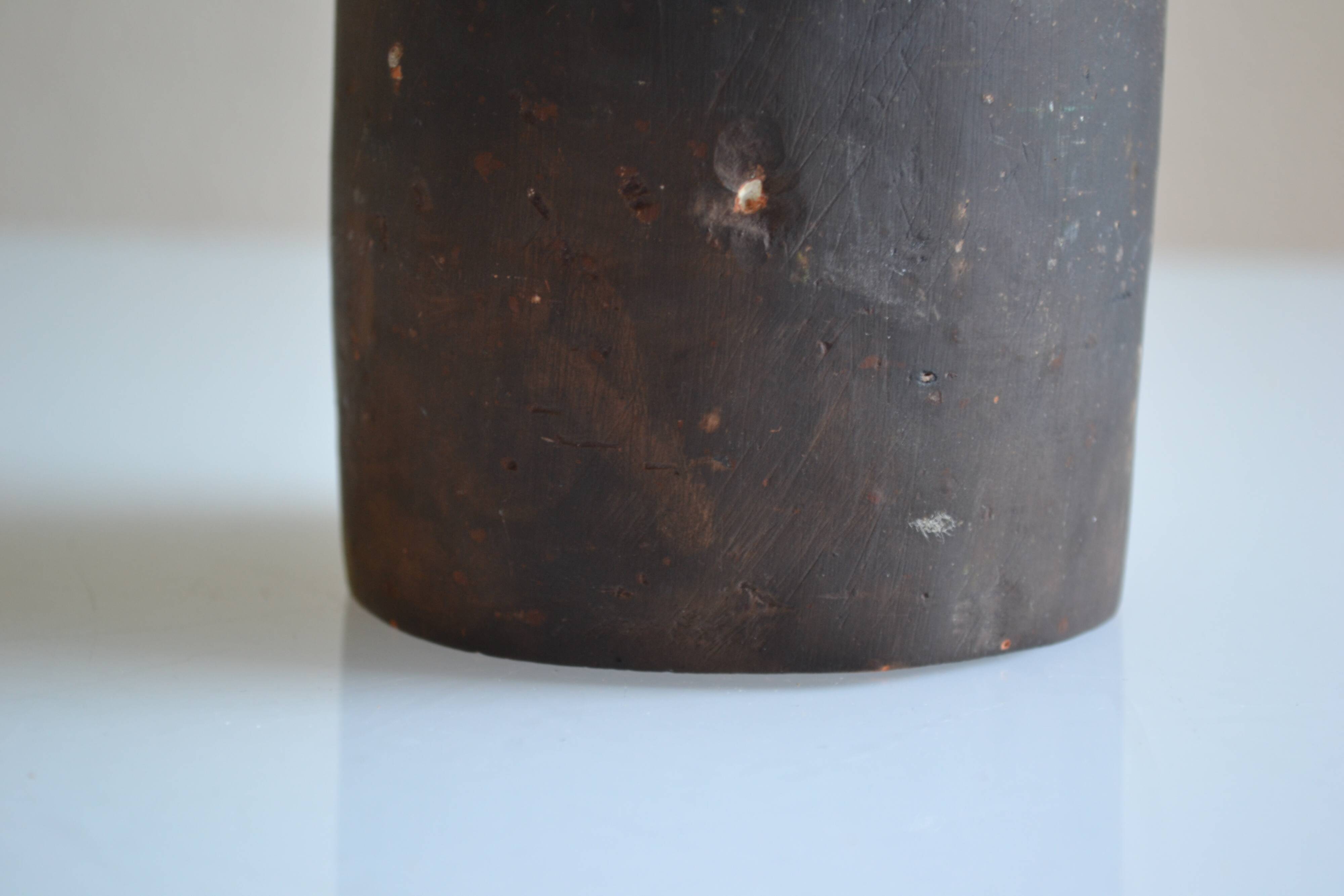 Ceramic bottle vase with a fish signature to be identified.
