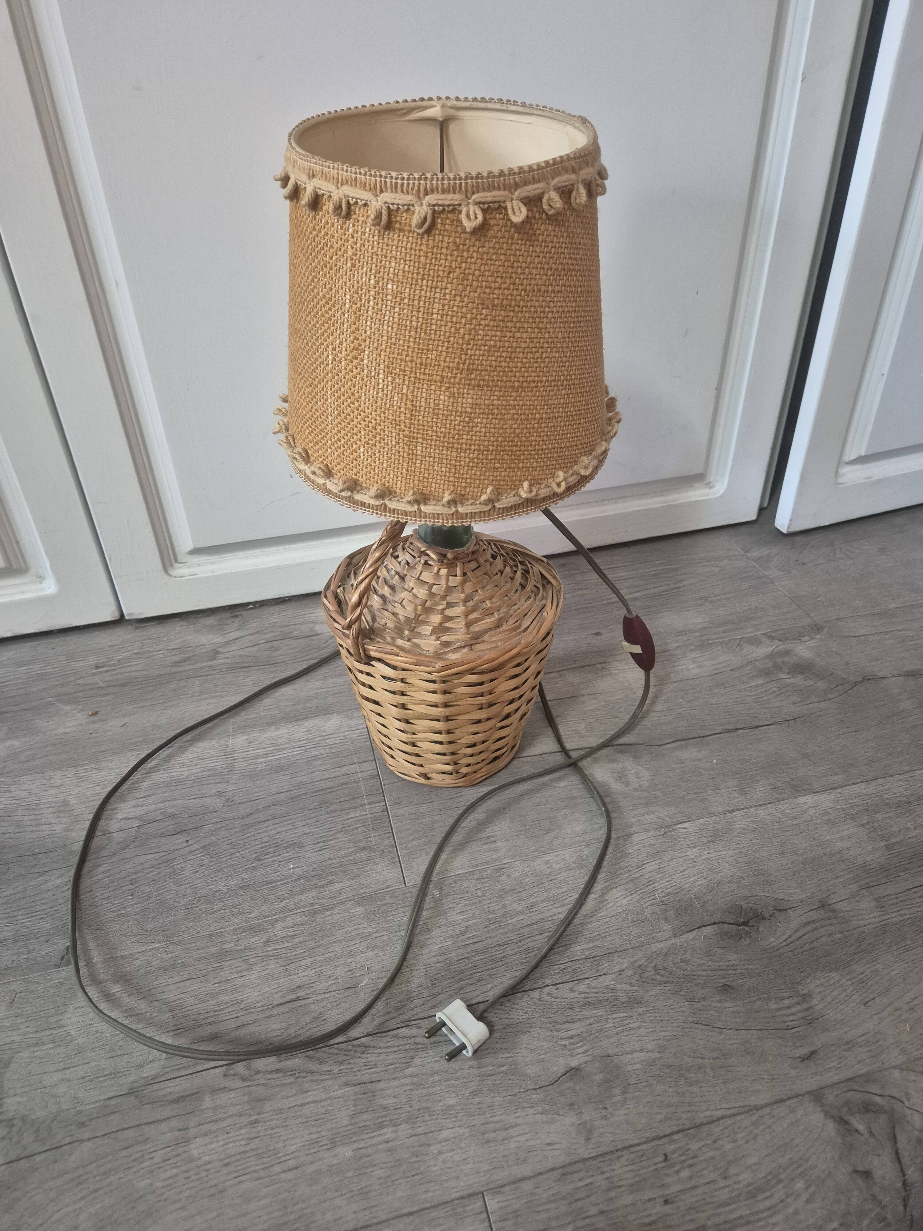 vintage table lamp dame jeanne covered in rattan wicker with a handle