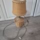 vintage table lamp dame jeanne covered in rattan wicker with a handle