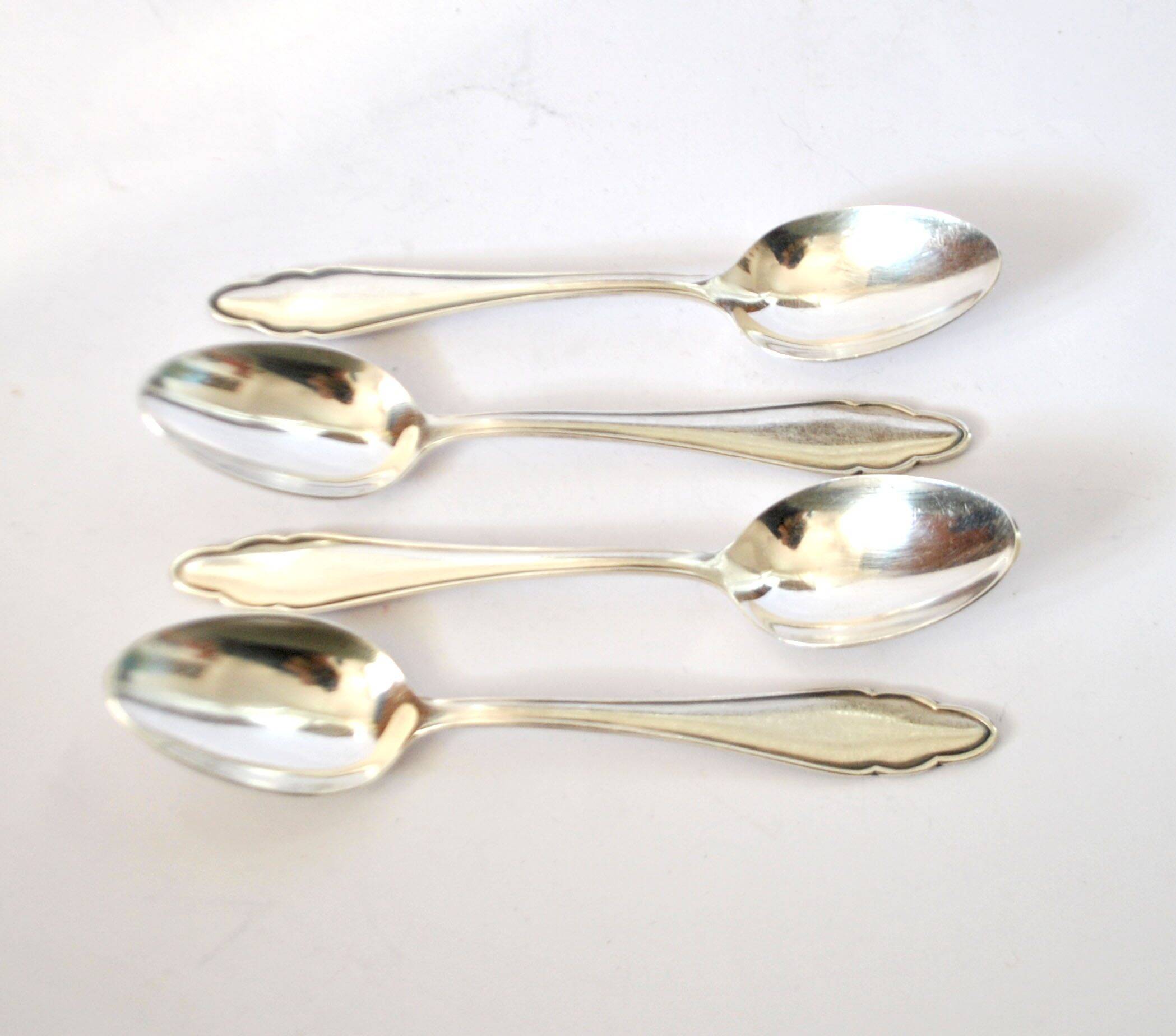 DEETJEN set of 4 silver-plated dessert spoons with a modernist scalloped design.