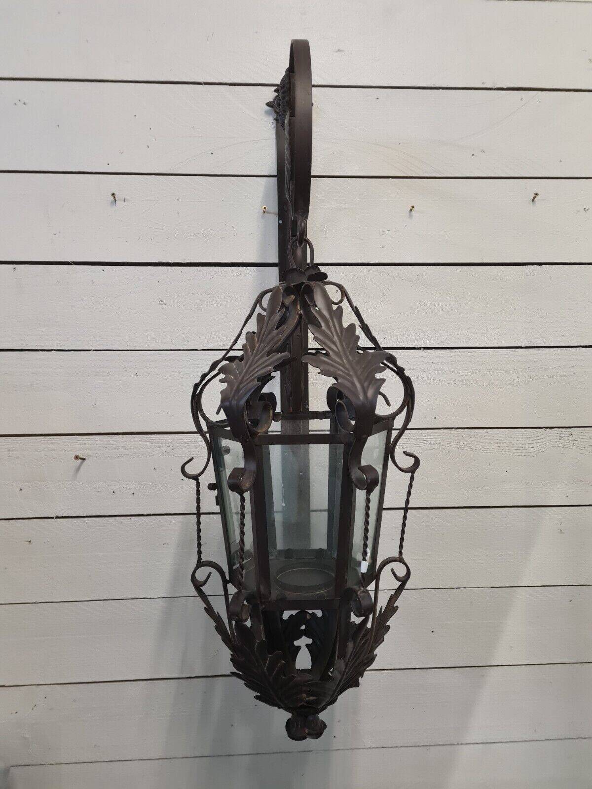 Patinated iron wall lantern