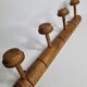 Old wall-mounted portmanteau, 4 patères, in turned wood, 52 cm