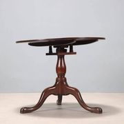 Small antique walnut table with a round top, United Kingdom, 19th century.