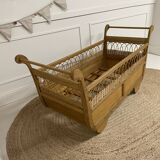 Wooden and rattan baby bed