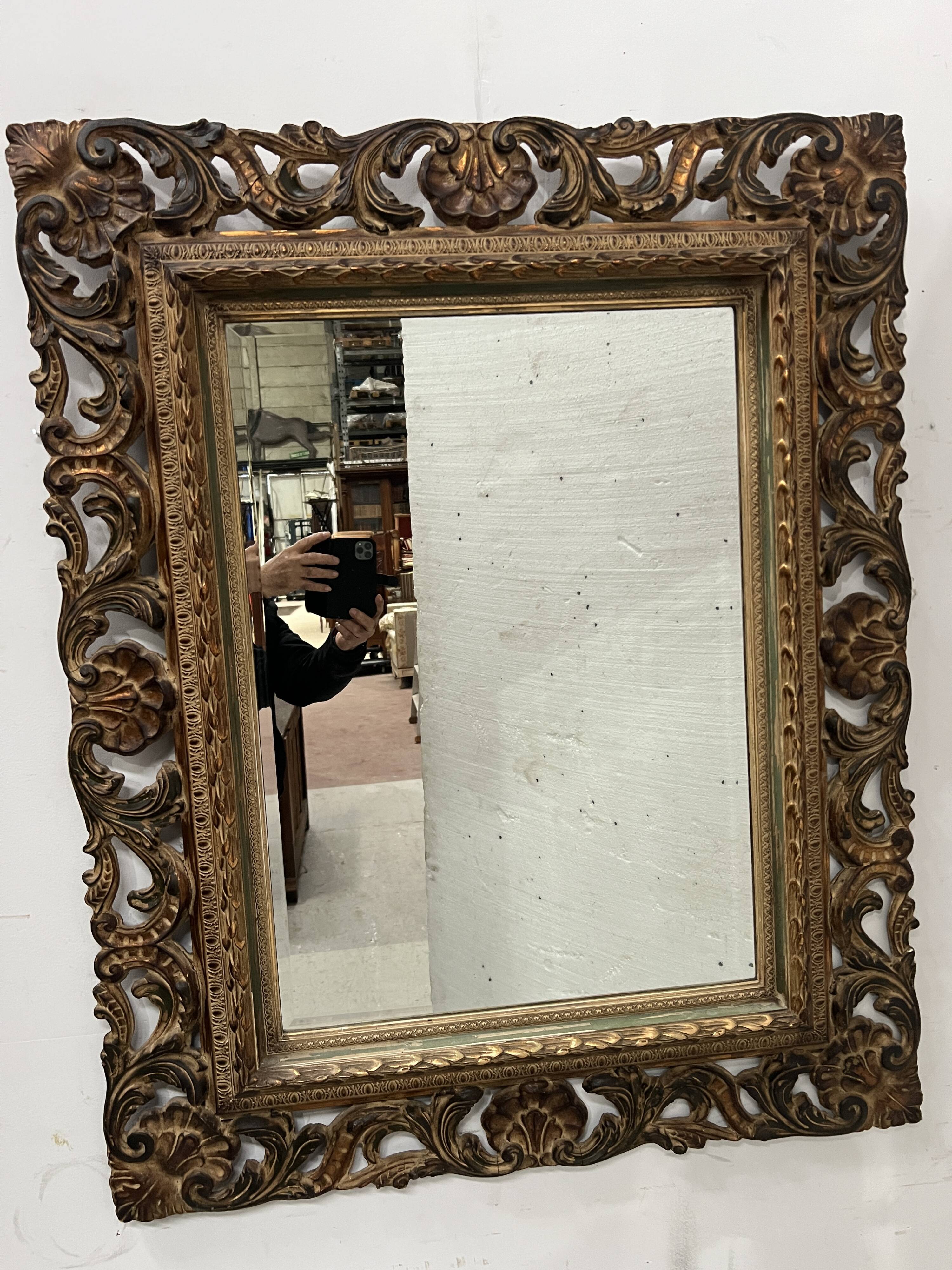 Napoleon III style mirror in carved wood, 20th century.