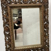 Napoleon III style mirror in carved wood, 20th century.