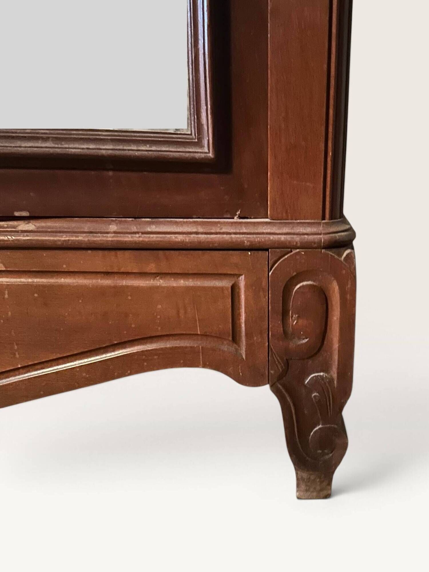 Louis XV style armoire with two bevelled mirror doors.