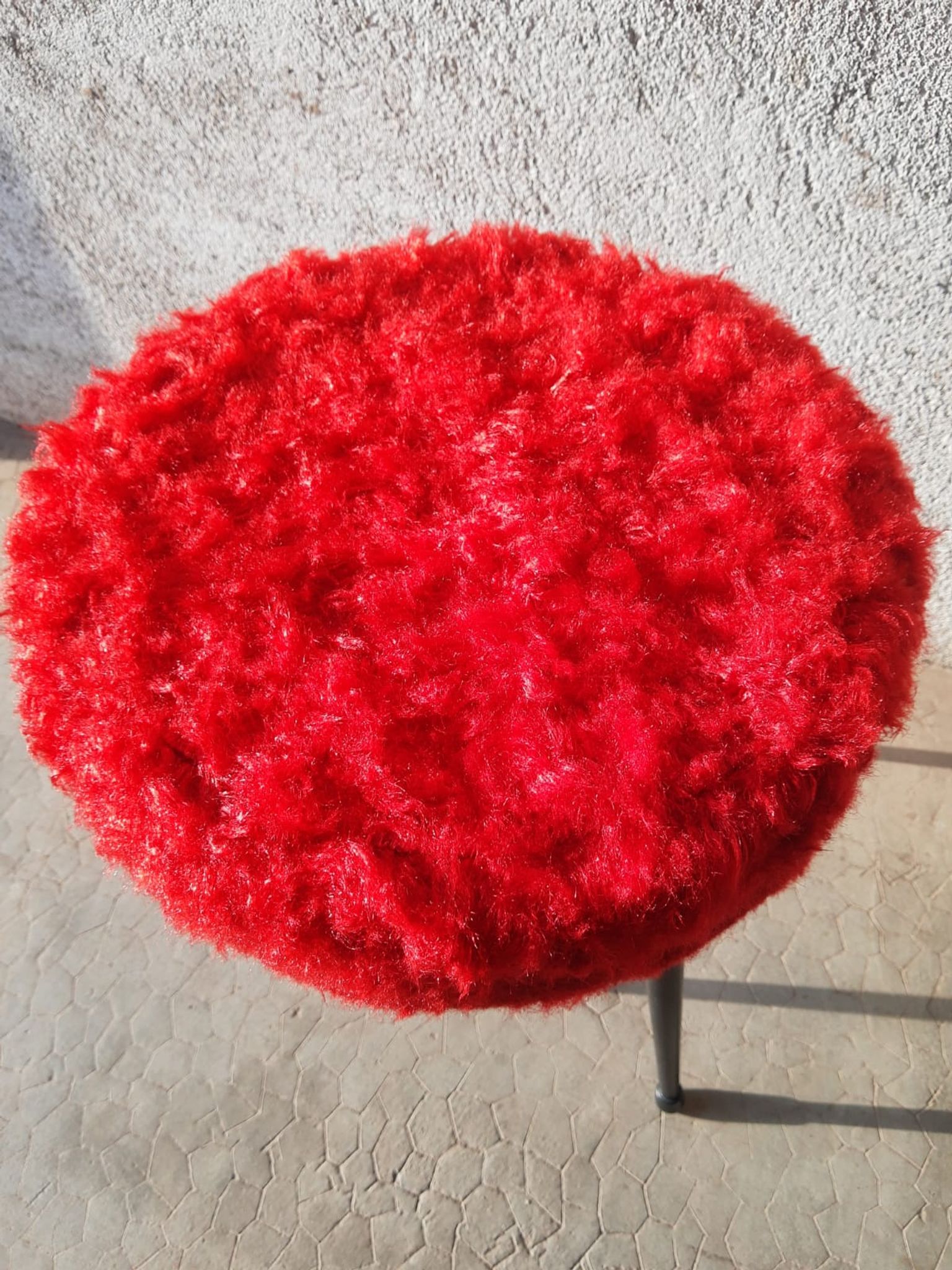Tripod stool with vintage red moumoute seat