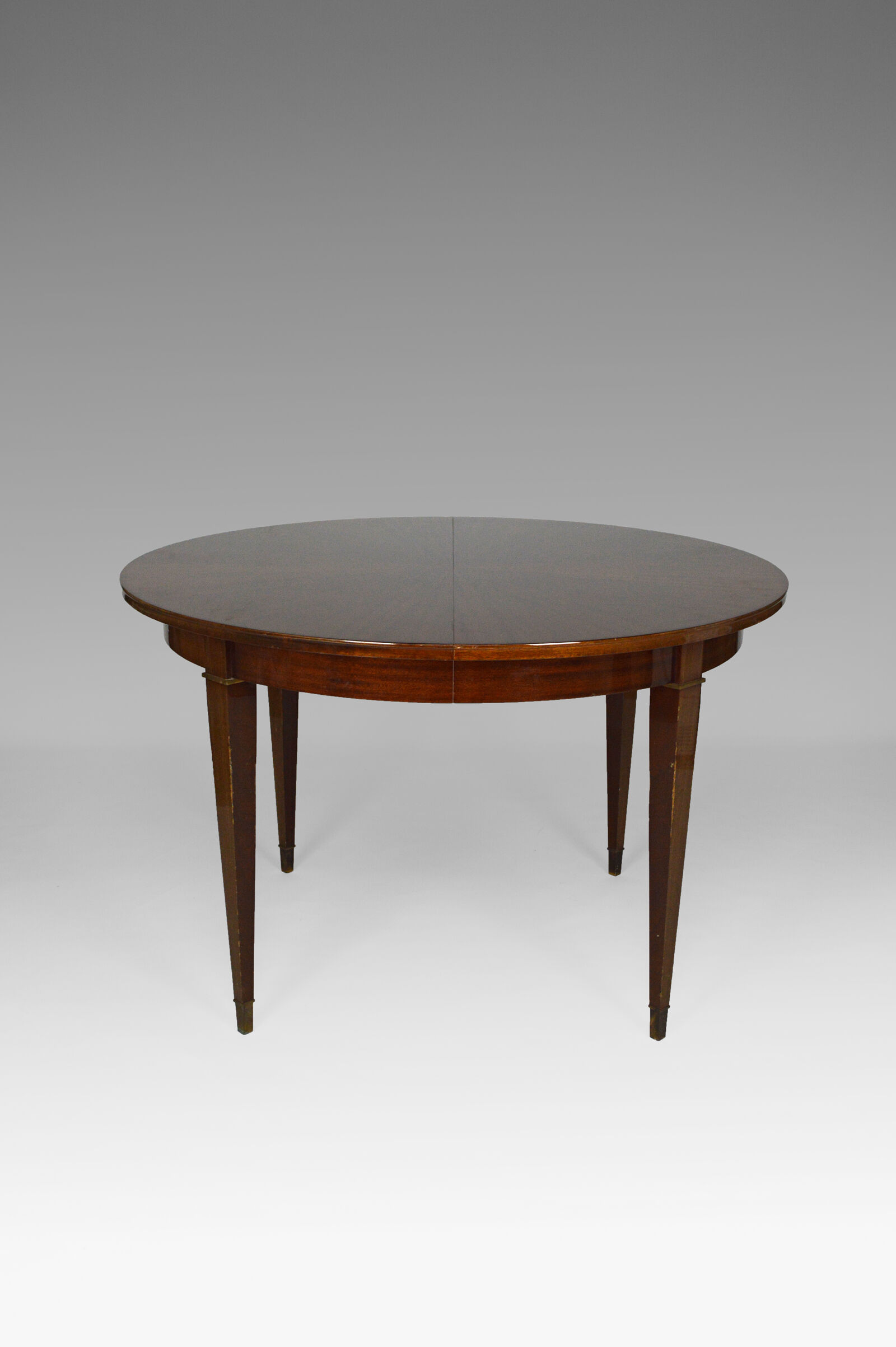 Art Deco mahogany round table by Jacques Adnet around 1940