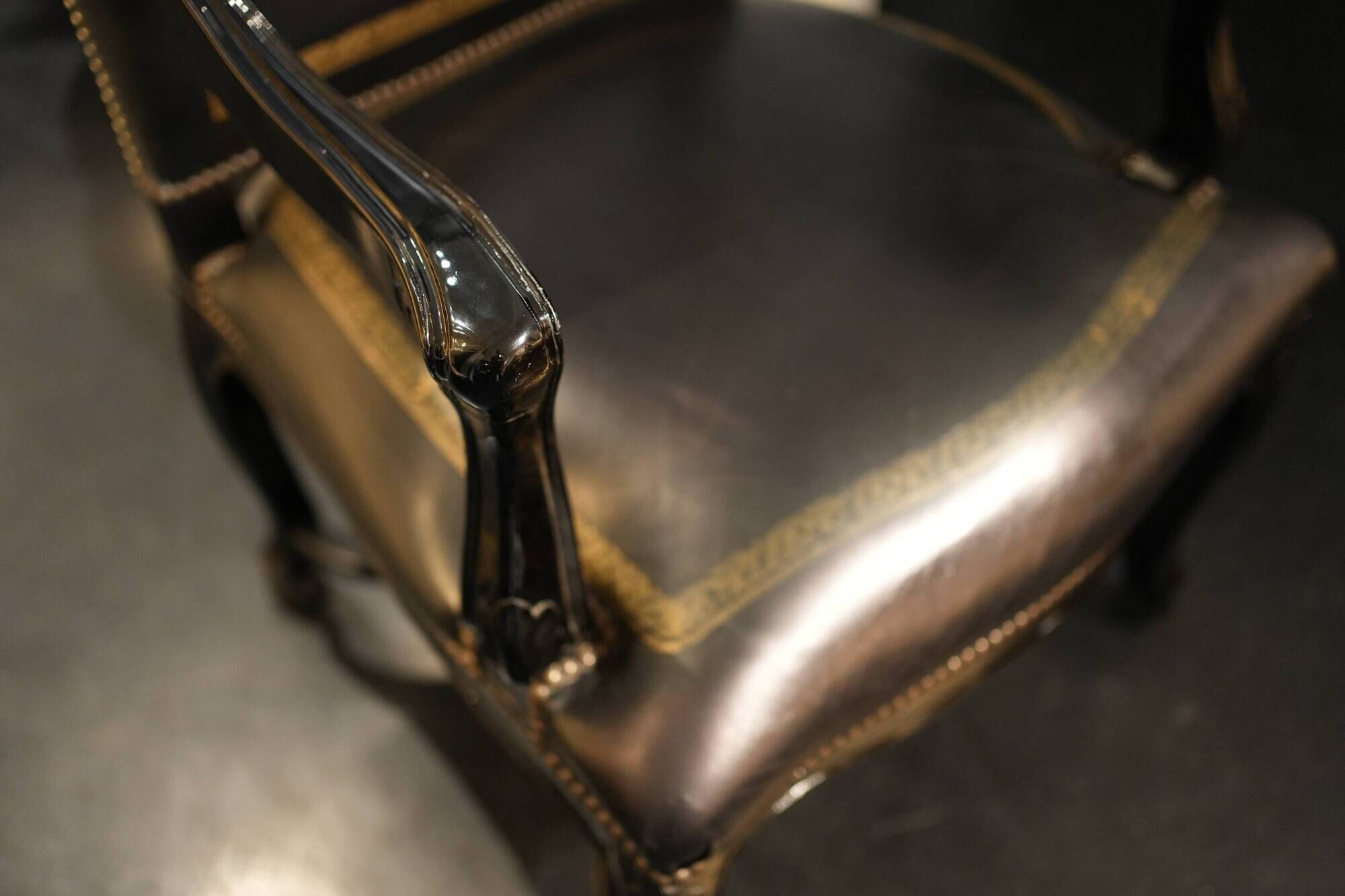 Lacquered and carved moulded wooden armchair