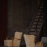 Pair of Mid Century Modern Swedish lounge chairs in birch and lamb's wool, 1960s.