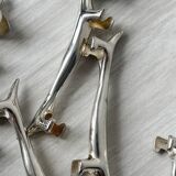 Metal dachshund dog knife holder.