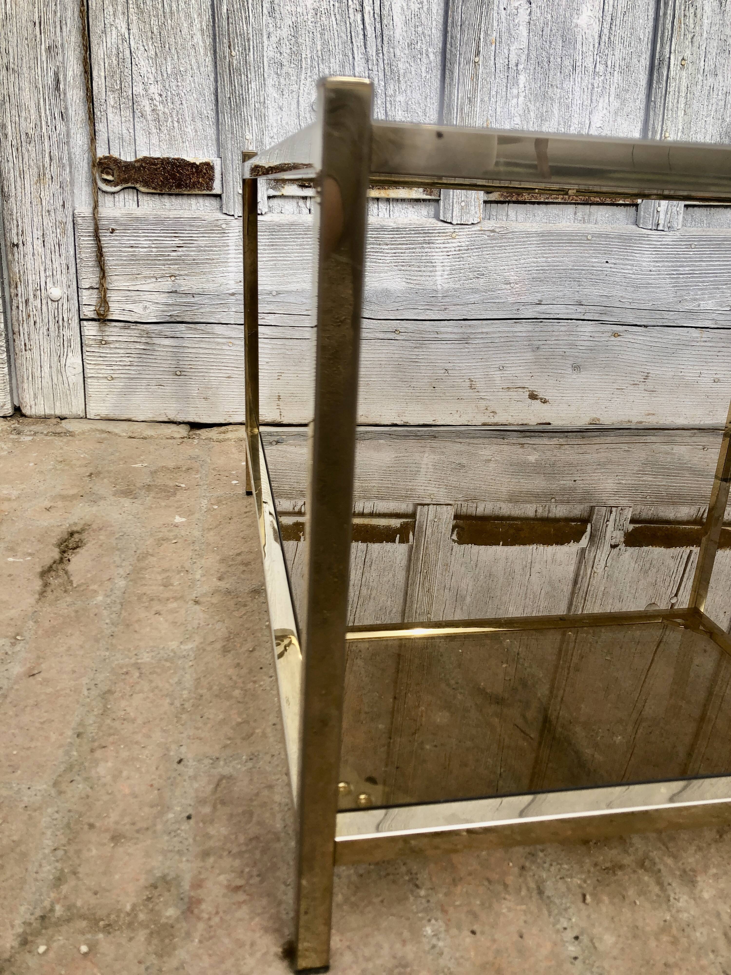 Square brass coffee table and smoked glasses