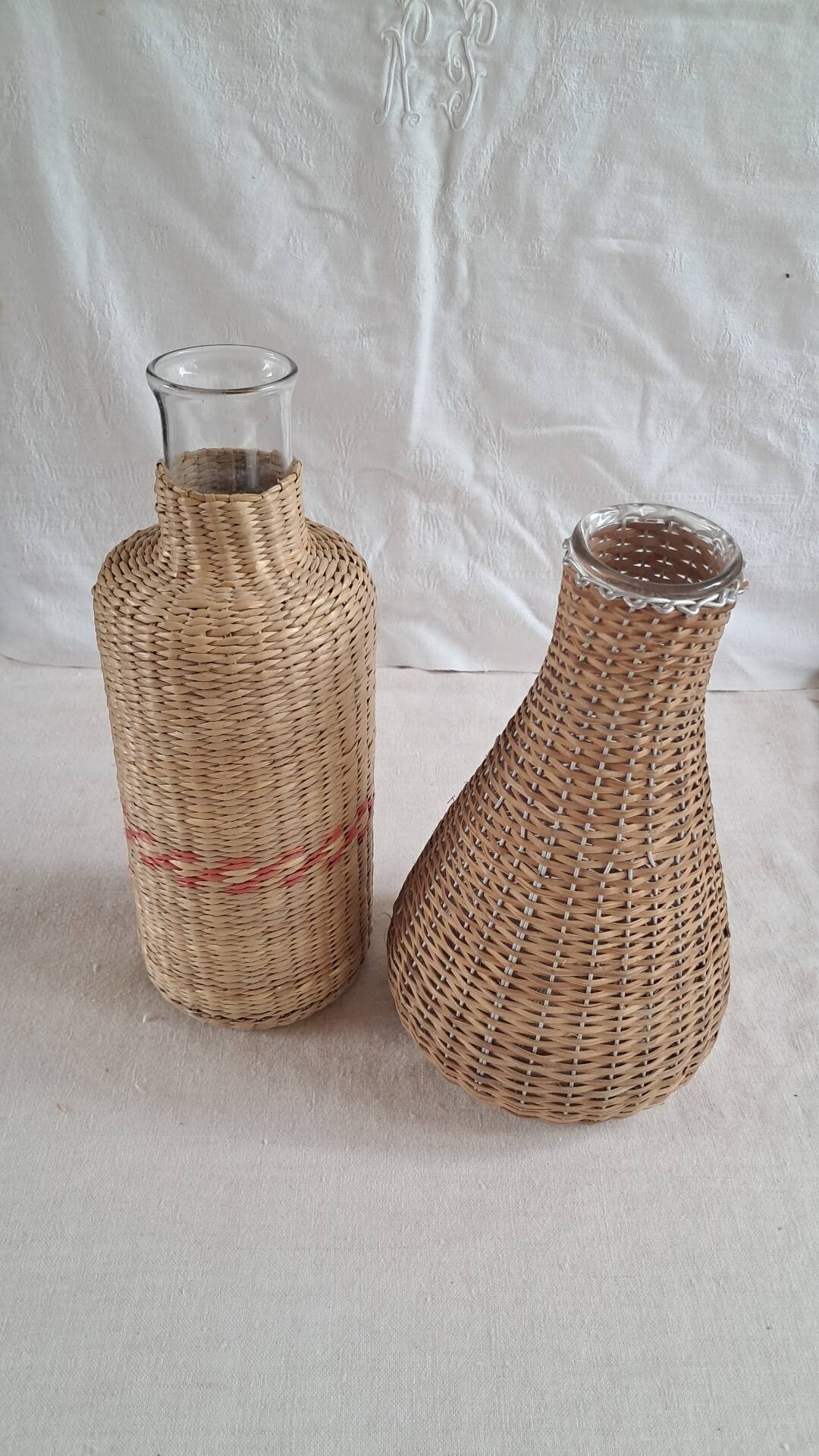 Pair of glass carafes / vases dressed in vintage woven rattan – A