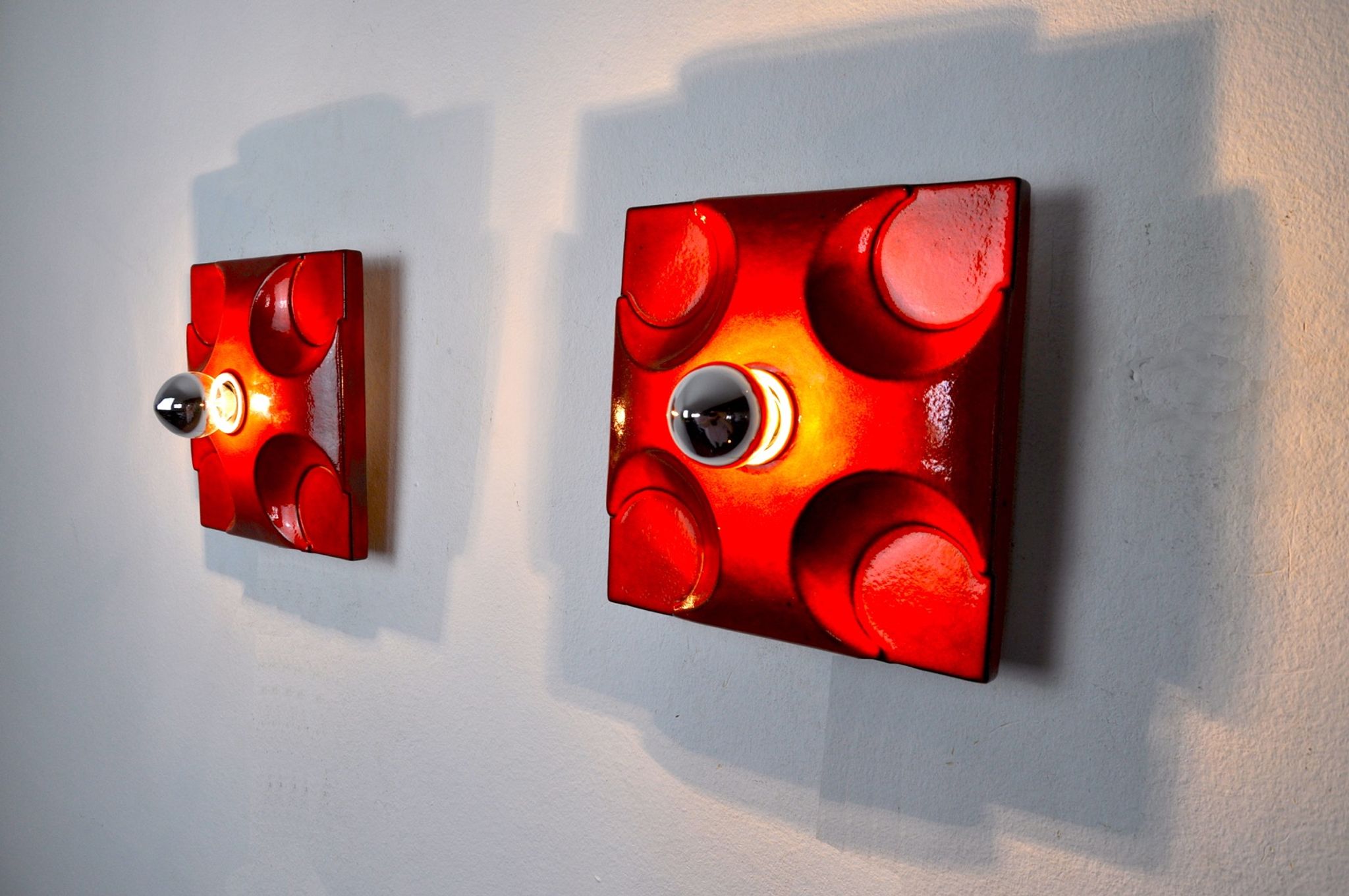 Pair of Fat Lava wall lamps by Hustadt Leuchten, Orange ceramic, Germany, 1960