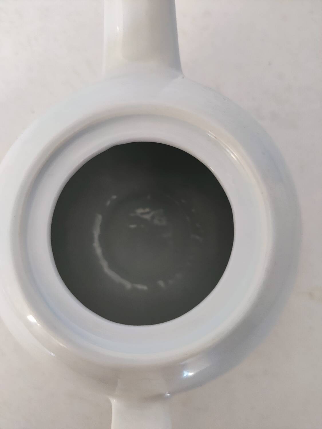 Small white porcelain teapot