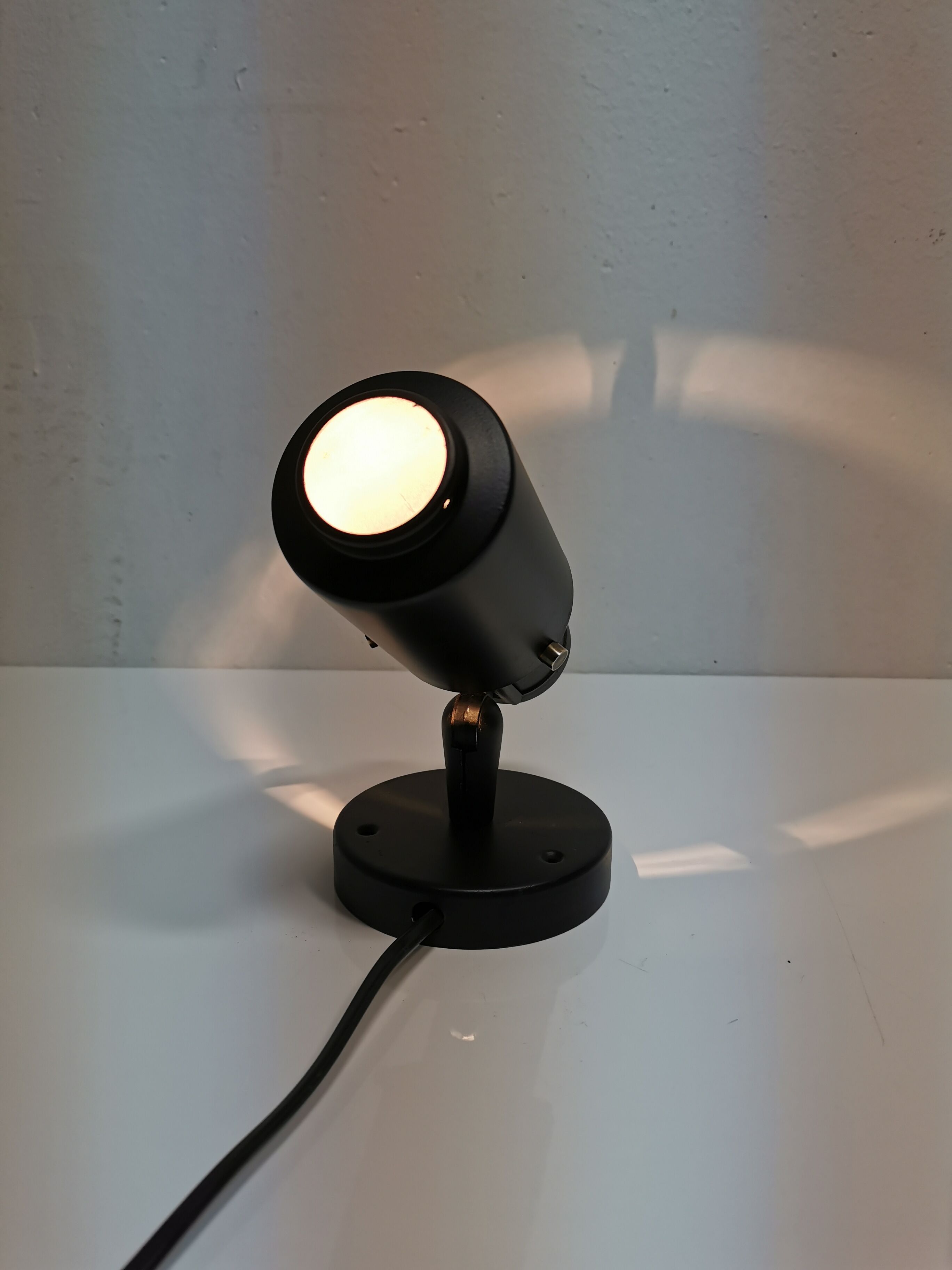 Jacques Biny's black zodiac sconce for Lita