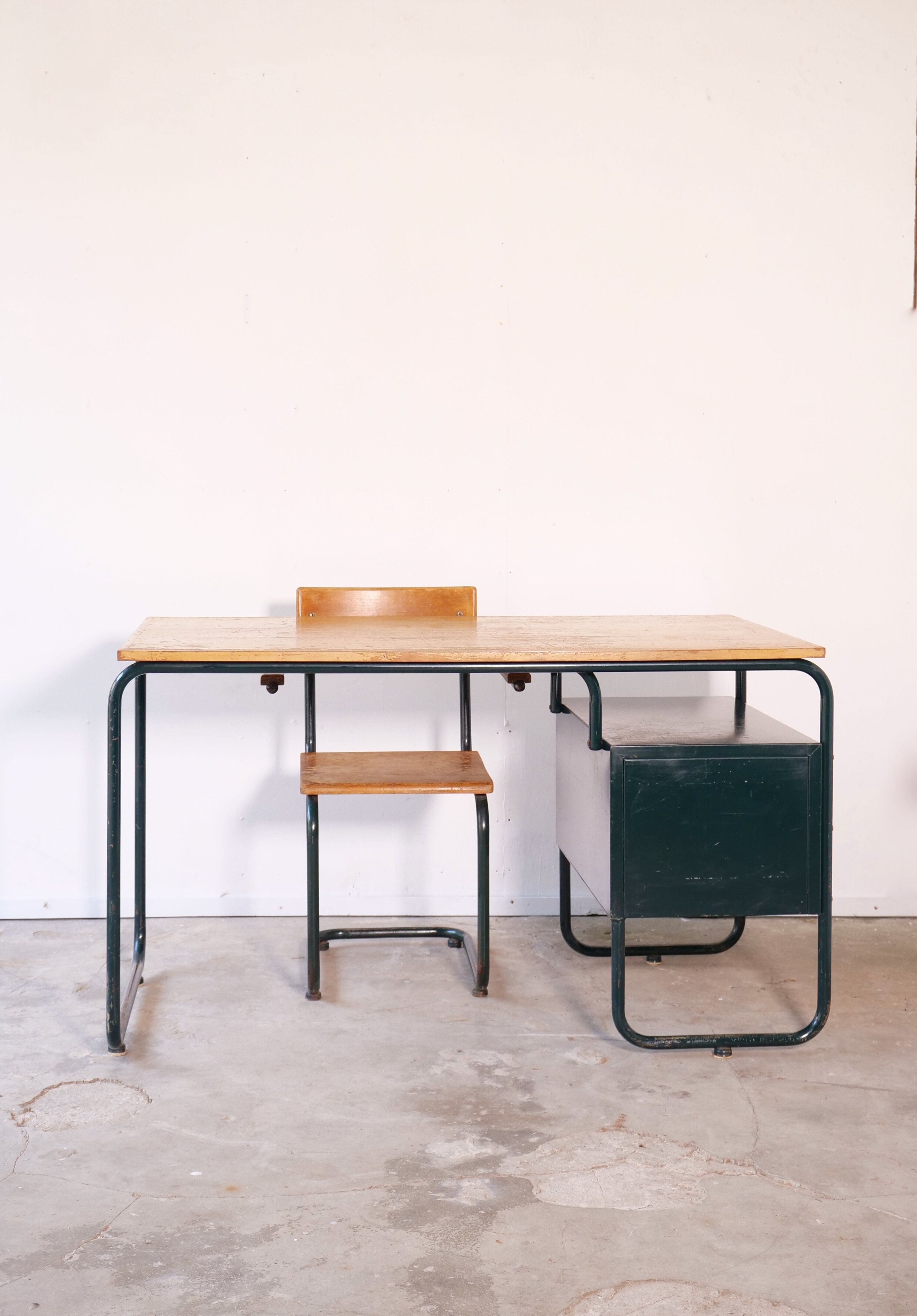 Desk with bauhaus style tubular steel chair