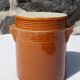 Trio of stoneware pots with lids