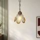 Vintage suspension with textured glass and amber-edged wood.