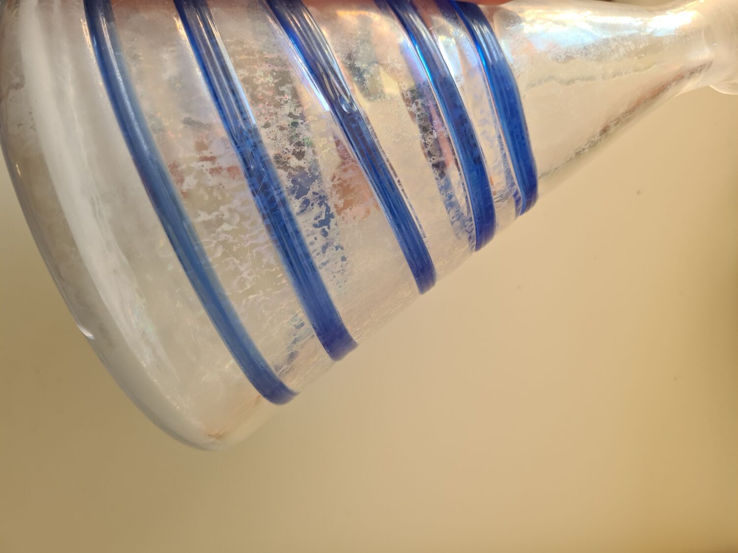 Conical glass vase/carafe blown with a blue spiral decoration.