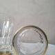 4 crystal whiskey glasses on gold frame