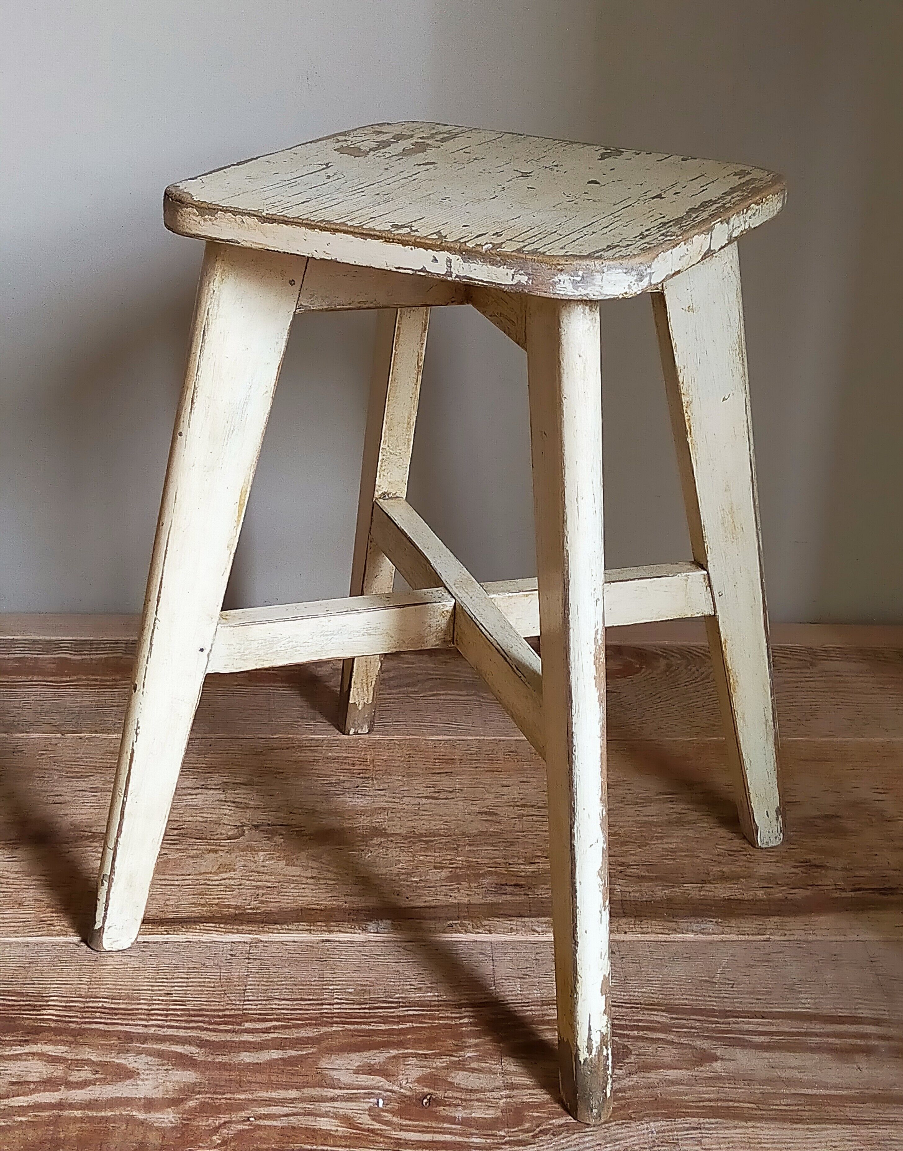 Old workshop stool in patinated solid wood