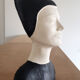 Bust of a woman in anthracite and white plaster