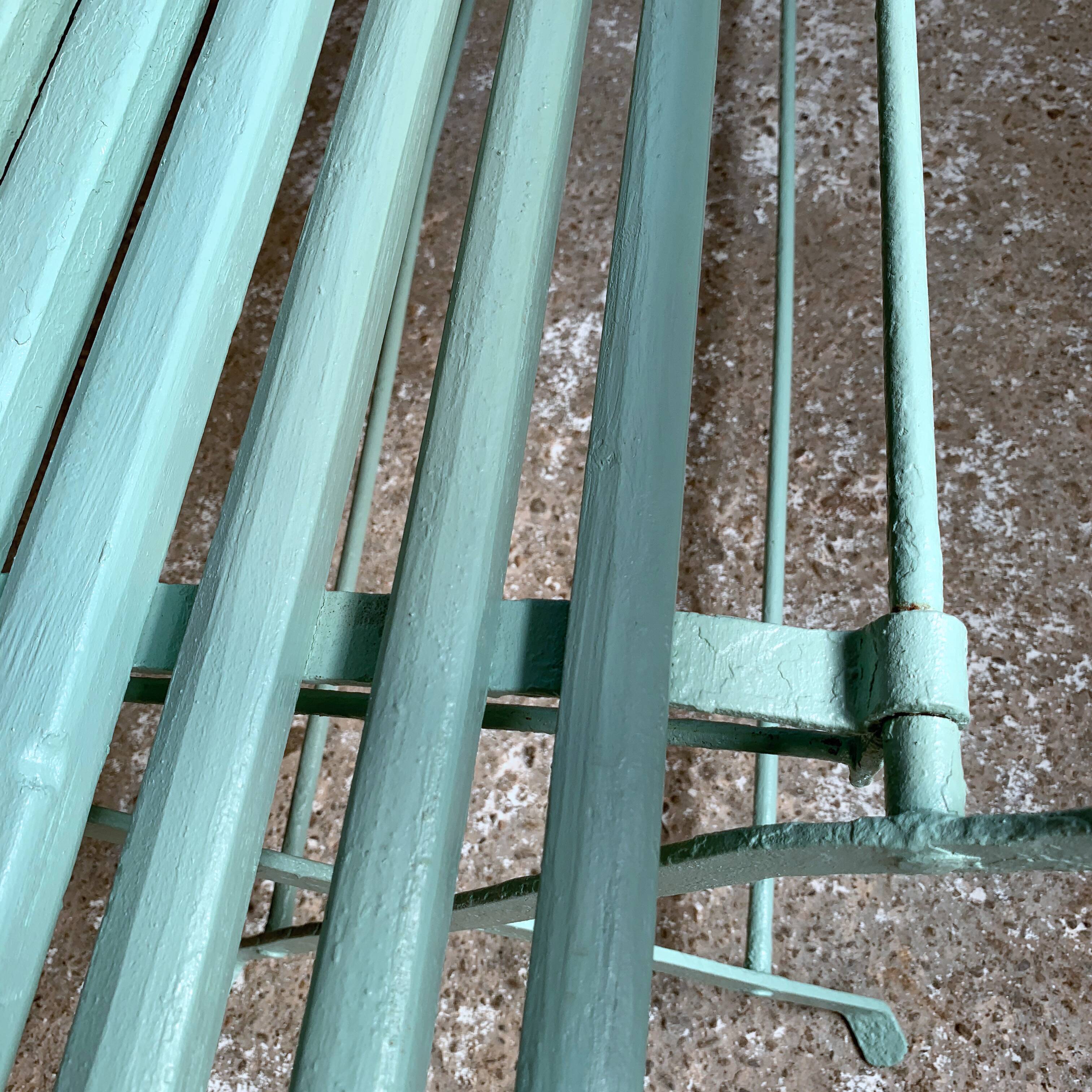 Former folding garden bench with wooden and metal slats