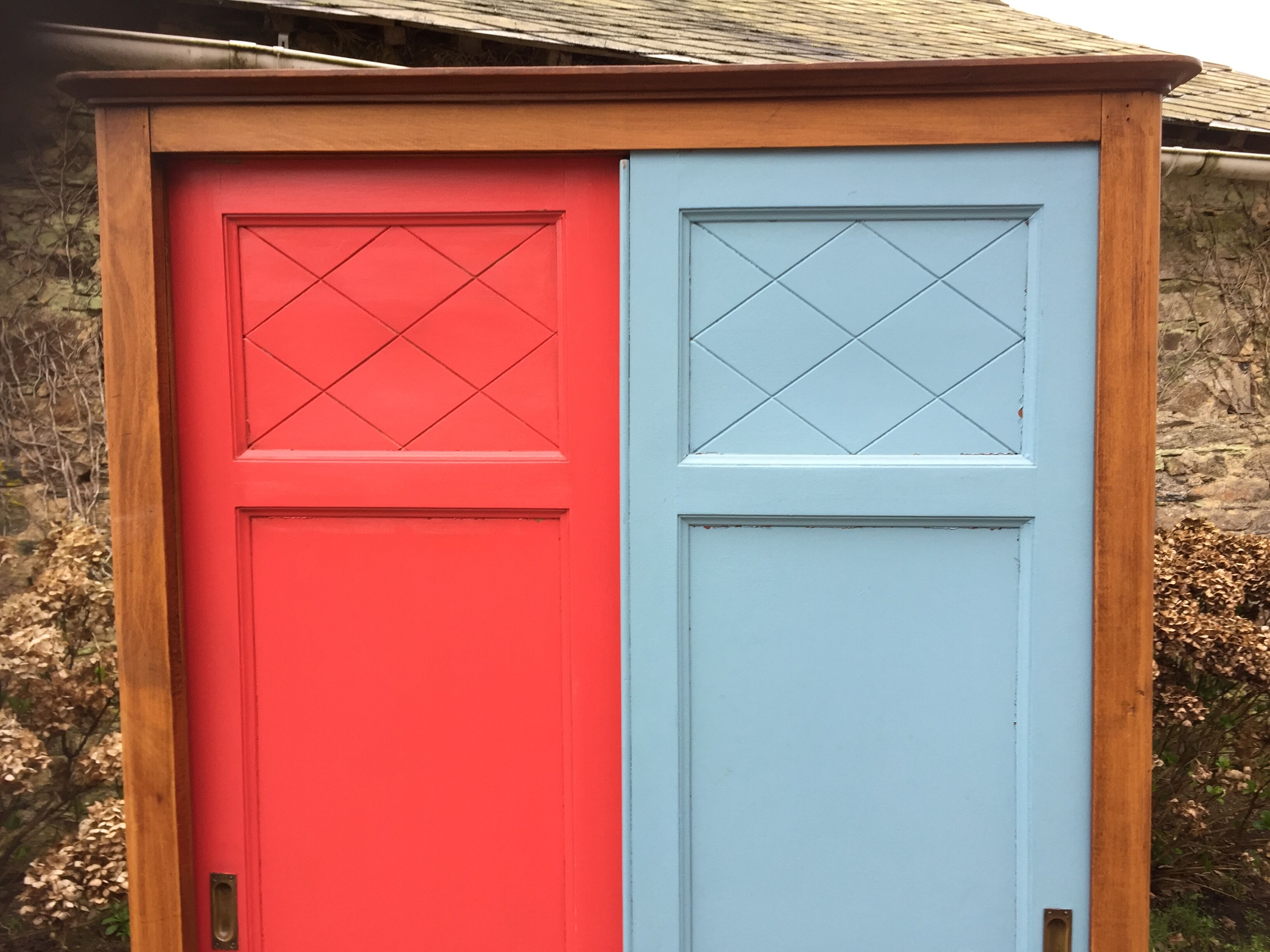 Vintage oak compass foot cabinet with 2 sliding doors painted red and blue