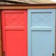 Vintage oak compass foot cabinet with 2 sliding doors painted red and blue