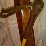 pair of vintage wooden Skis and their bats.