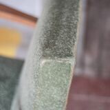 Art Deco armchair in wood and green fabric, living room armchair, interior decor.