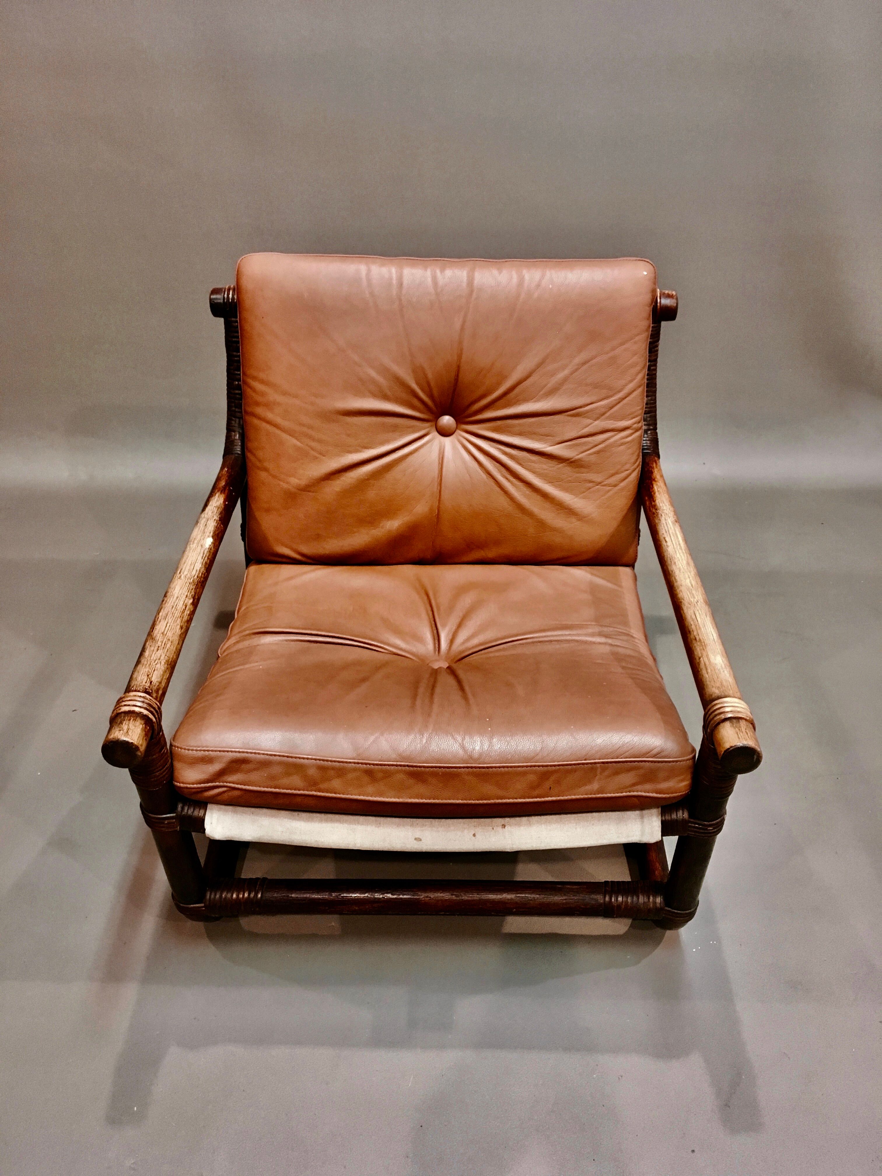 Fauteuil et son ottoman rotin et cuir 1950