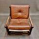 Fauteuil et son ottoman rotin et cuir 1950