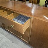 According to André Arbus, a sideboard in a row from the Art Deco period in blonde mahogany.