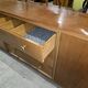 According to André Arbus, a sideboard in a row from the Art Deco period in blonde mahogany.