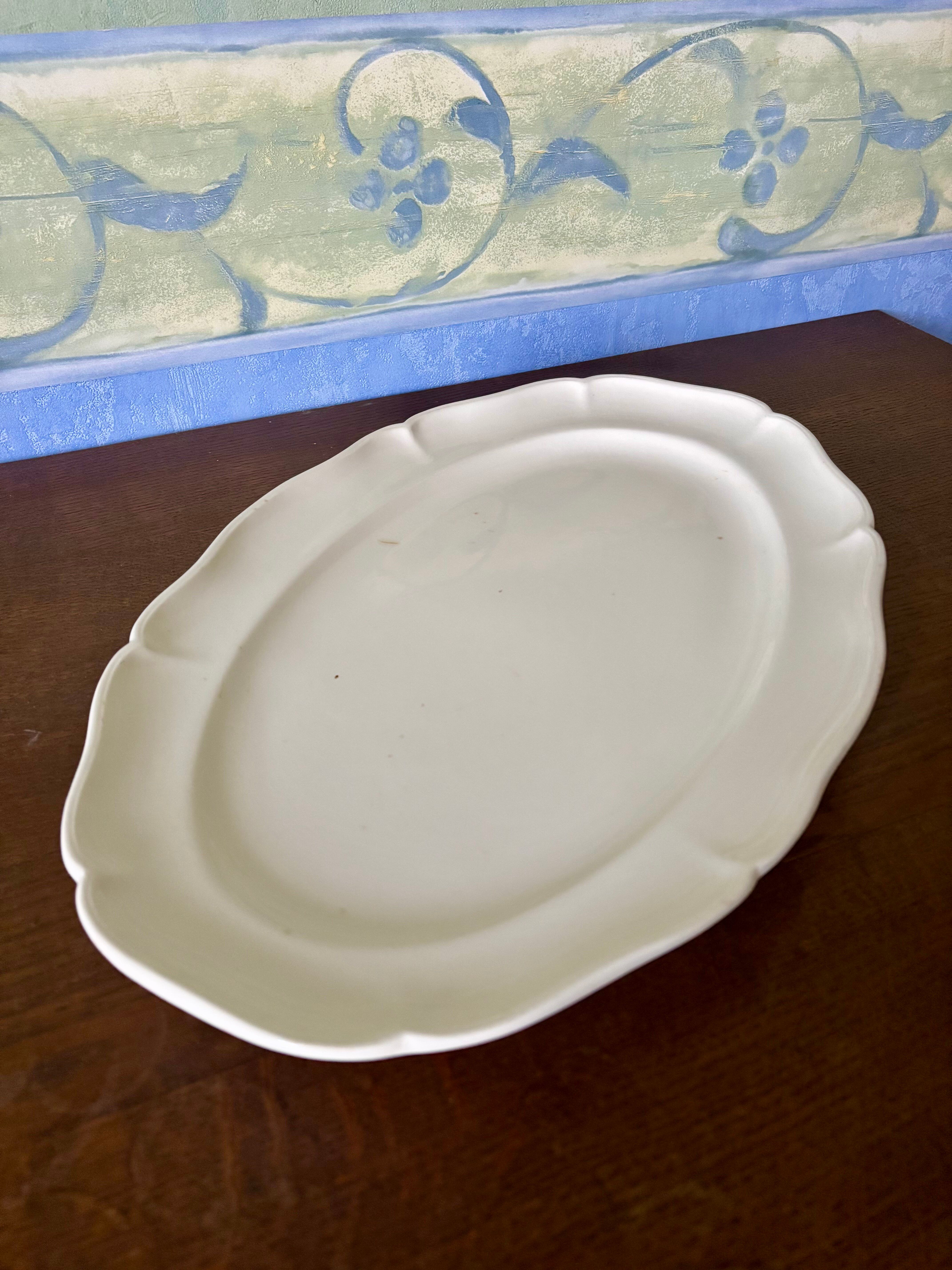Old very large serving platter with scalloped edges by Villeroy and Boch.