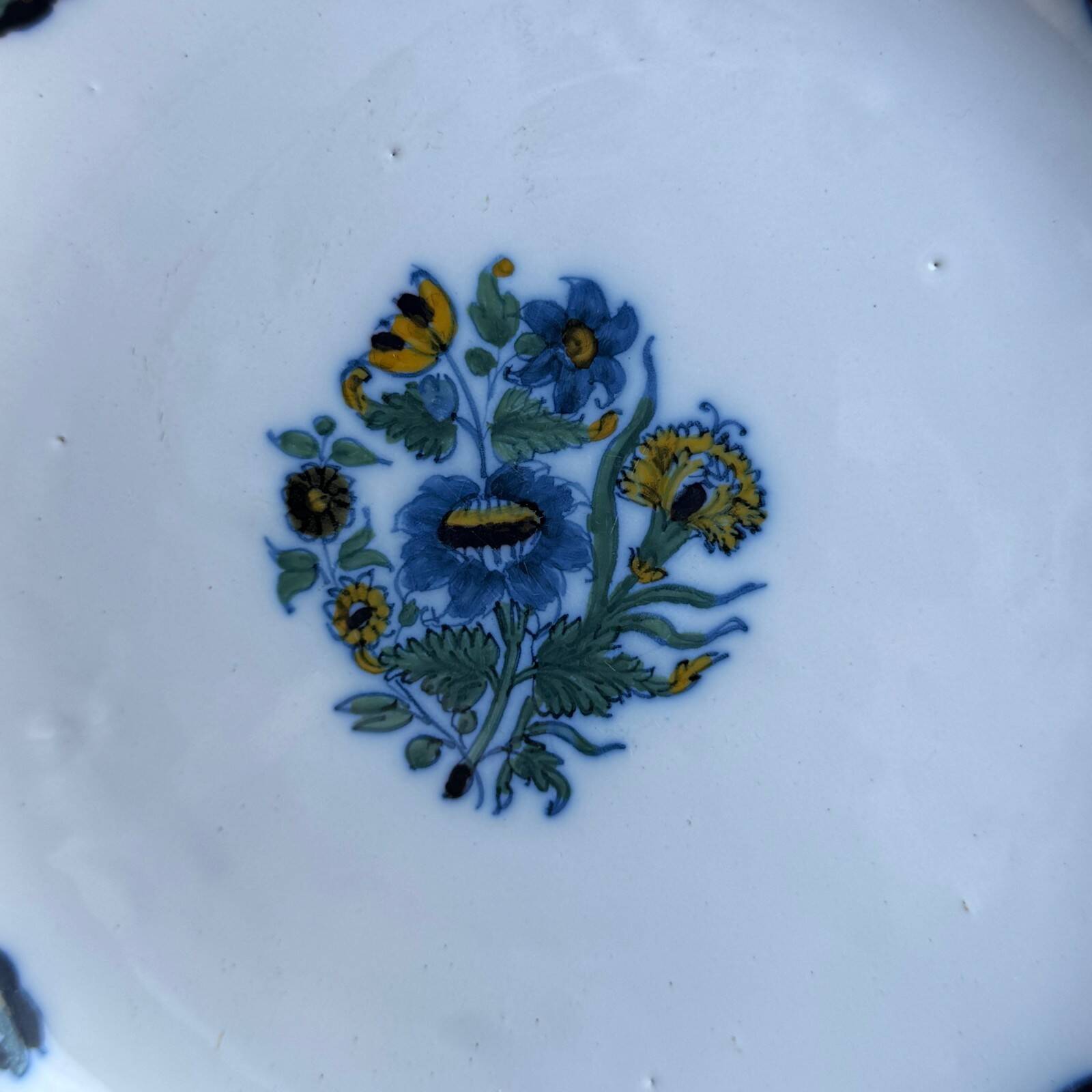 18th-century Moustiers earthenware plate with floral decoration