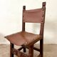 Spanish chair in leather and carved wood, 1950s/60s.