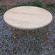 Round neoclassical coffee table with a marble top and golden metal base.