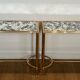 Pair of brass and antique mirror side tables from the Baguès house.