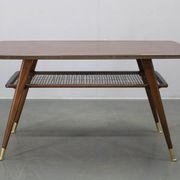 Mid-century German coffee table with rattan shelf and brass legs