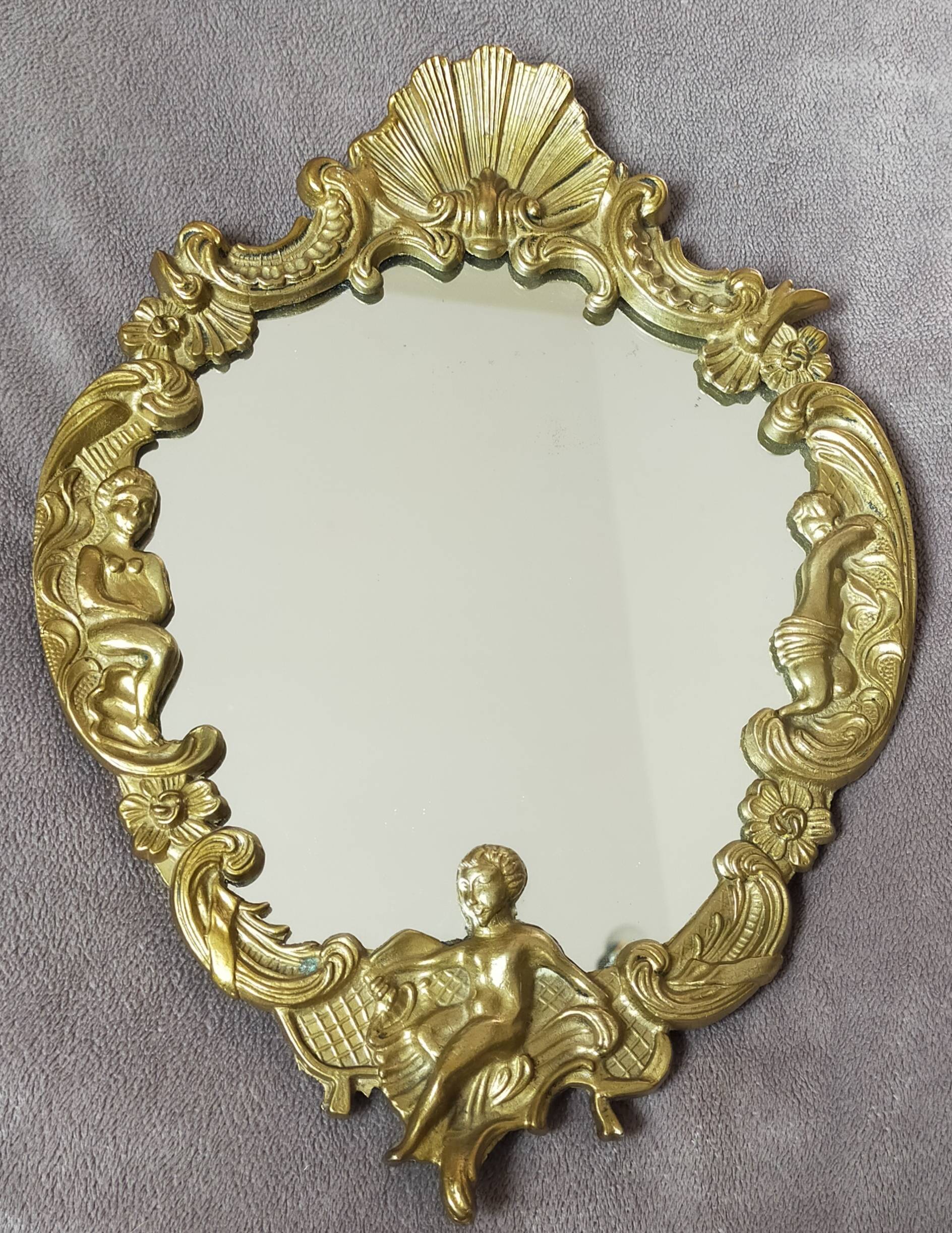 Gilded bronze mirror with angel ornament