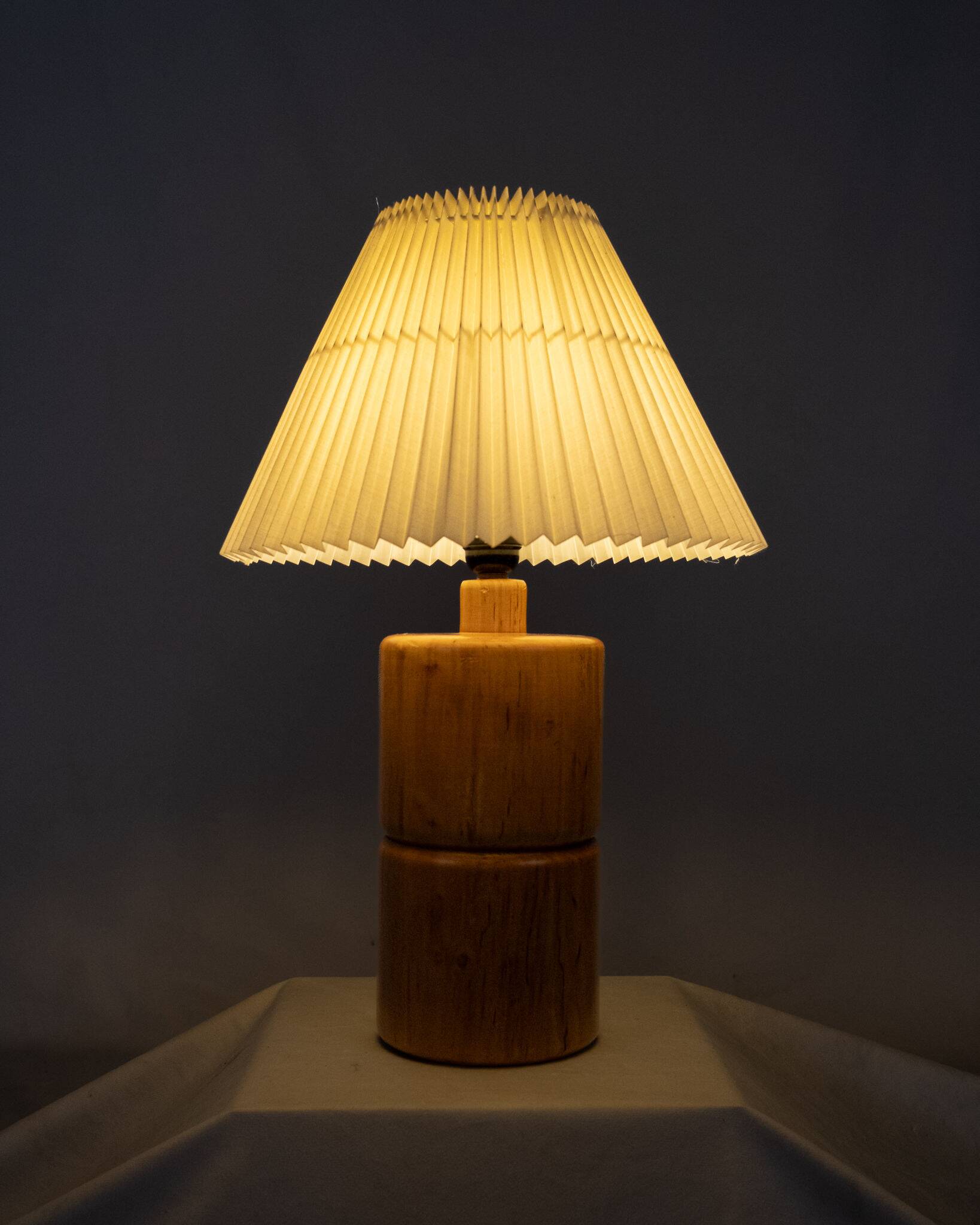 Cylindrical table lamp made of solid turned wood, France, 1970.