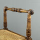 Banquette / tabouret en bois sculpté et cannage, XXe siècle