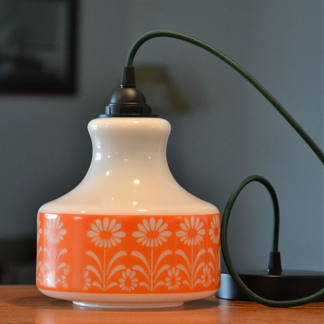 Seventies chandelier in white opaline decorating orange flowers